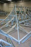 Curved steel roof on factory floor
